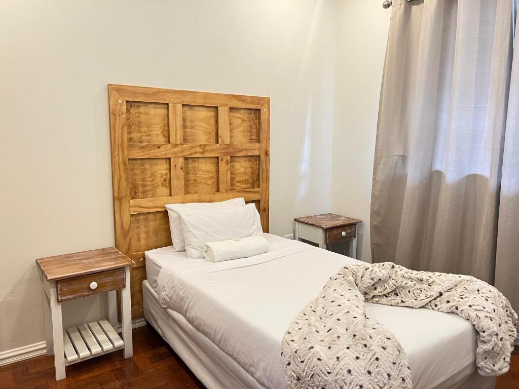 Una cama o camas en una habitación de La Vue