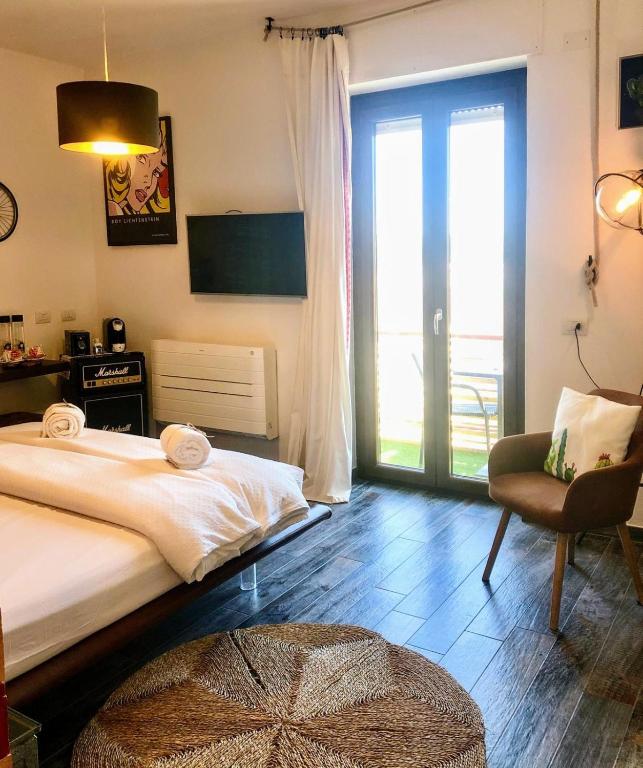 Een bed of bedden in een kamer bij S'accabbadora Guest House