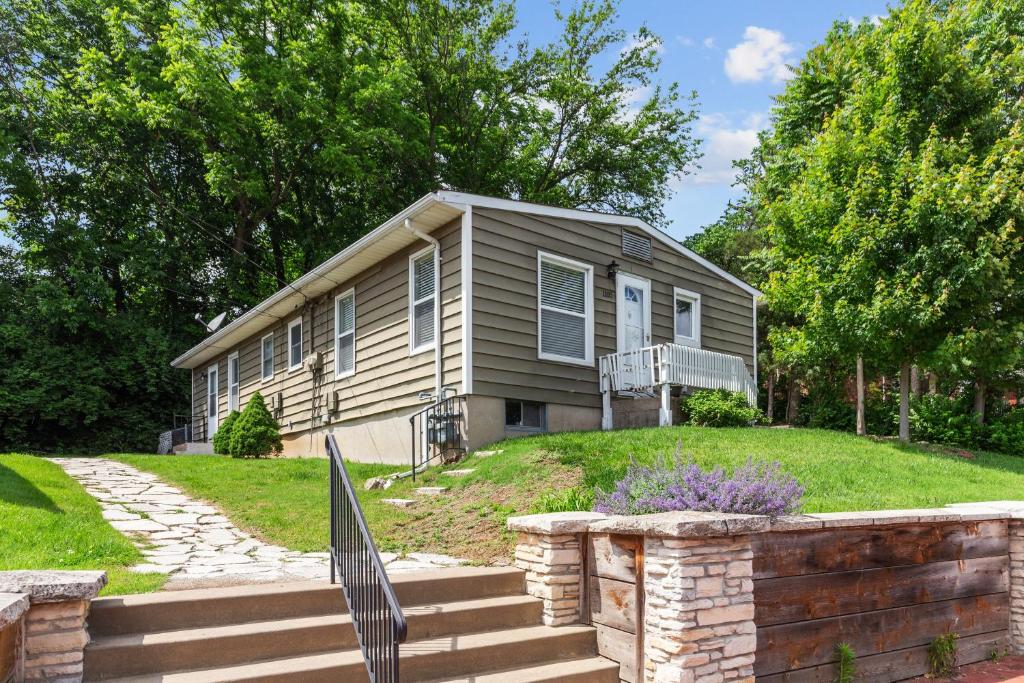 a house with a fence in front of it at Duplex Hideaway in Saint Charles MO in St. Charles