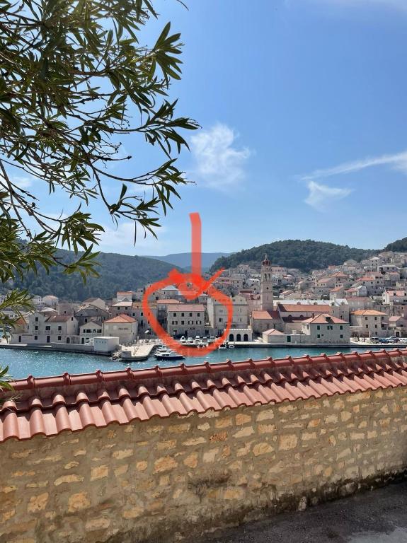 a red object in the middle of a city at Apartmani Brač in Pučišća