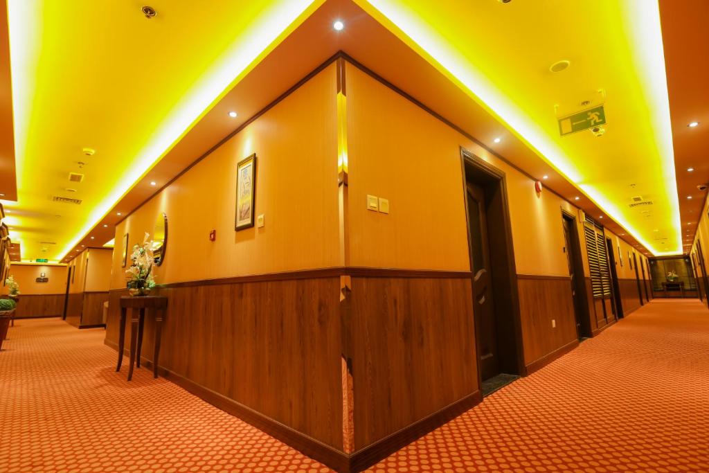 a hallway with a row of stalls in a building at Fortune Pearl Hotel in Dubai