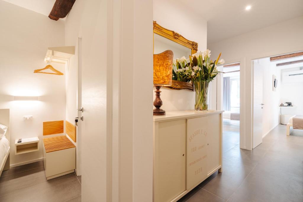 Postel nebo postele na pokoji v ubytování Oblò Portovenere Guesthouse