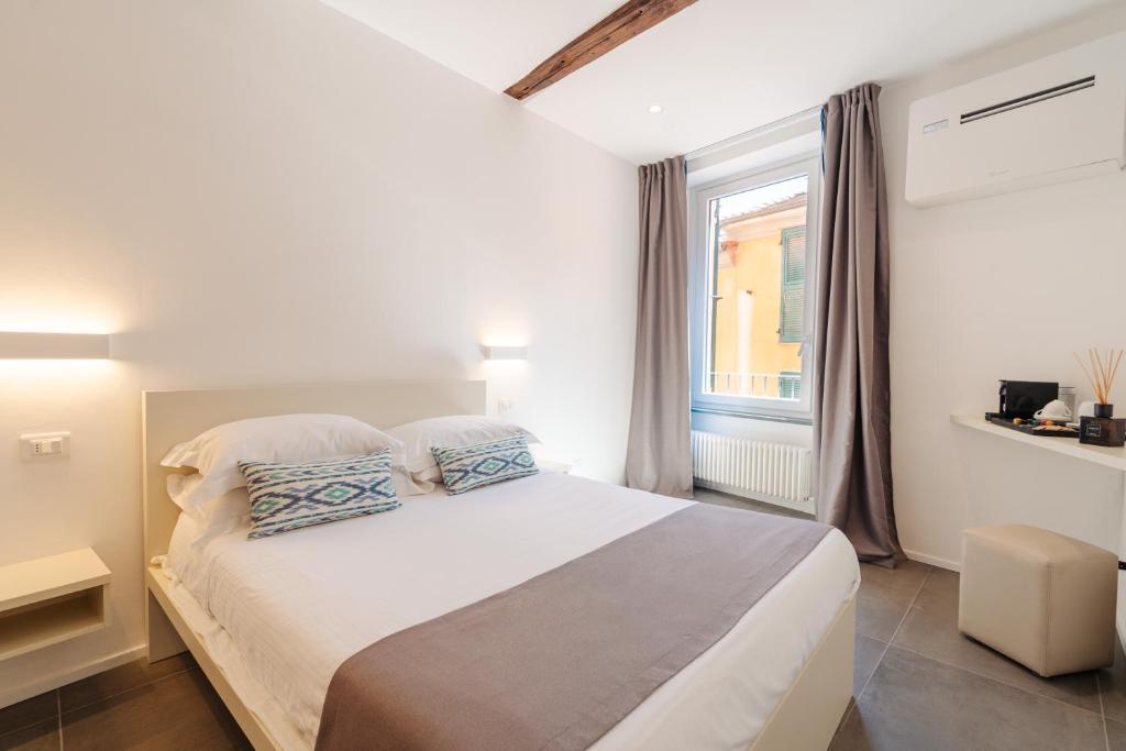 Postel nebo postele na pokoji v ubytování Oblò Portovenere Guesthouse