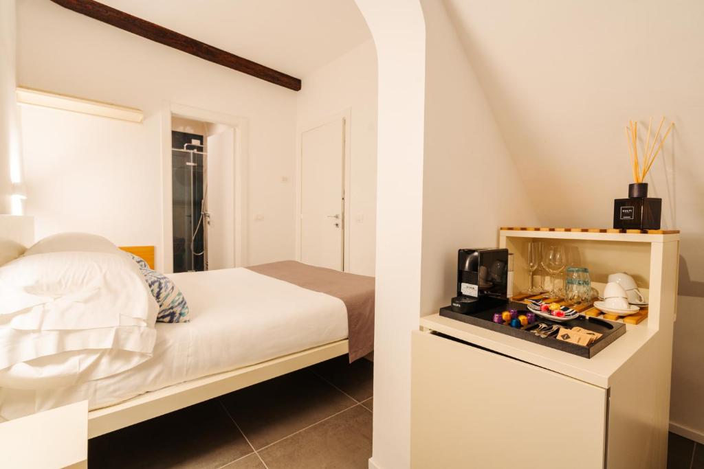 Postel nebo postele na pokoji v ubytování Oblò Portovenere Guesthouse
