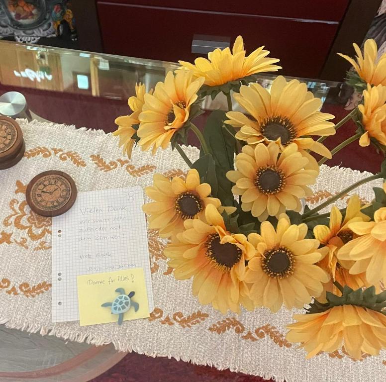 a bouquet of yellow sunflowers on a table at Eri in Grünstadt