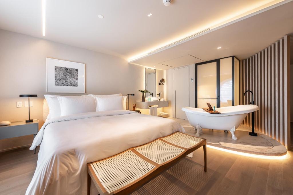Postel nebo postele na pokoji v ubytování Hotel Unique