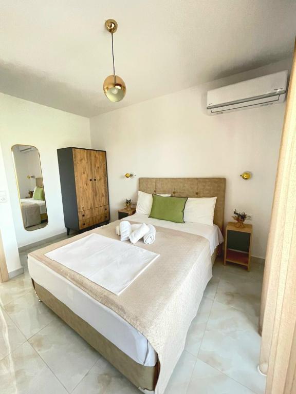 a bedroom with a large bed in a room at Eternity fresh in Limenaria