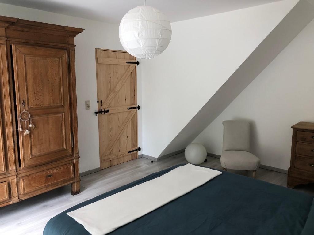 Postel nebo postele na pokoji v ubytování Les écuries