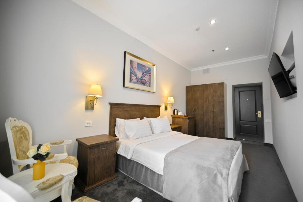 Postel nebo postele na pokoji v ubytování Address Hotel Yerevan by Imperial