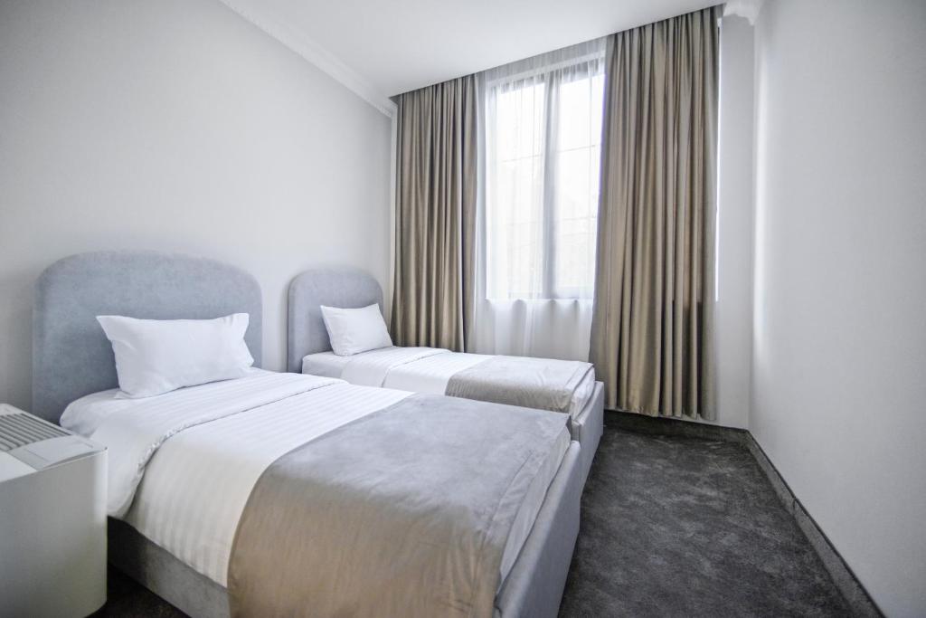 Postel nebo postele na pokoji v ubytování Address Hotel Yerevan by Imperial