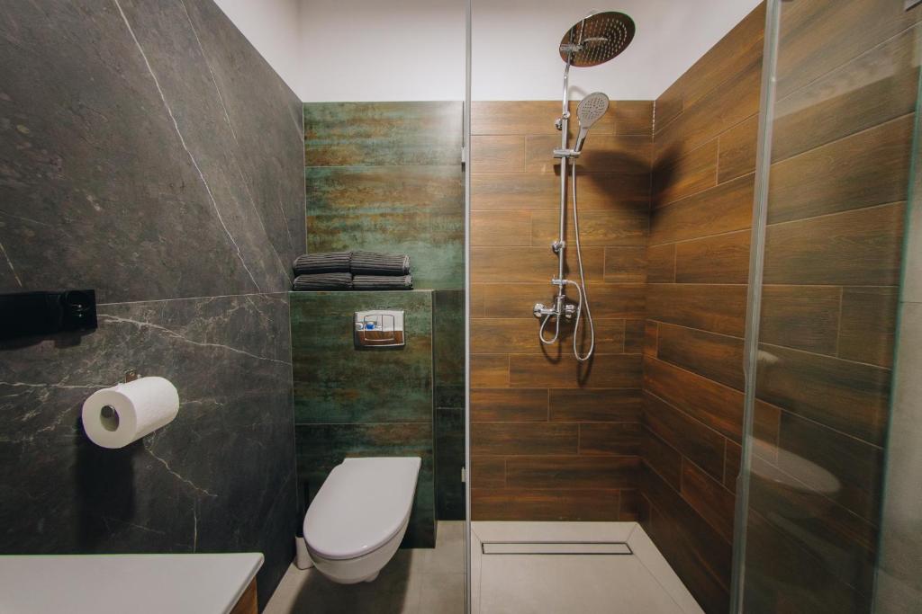 Kúpeľňa v ubytovaní Apartamenty Leśna