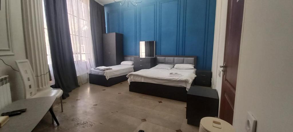 Postel nebo postele na pokoji v ubytování NEW BELLA HOTEL