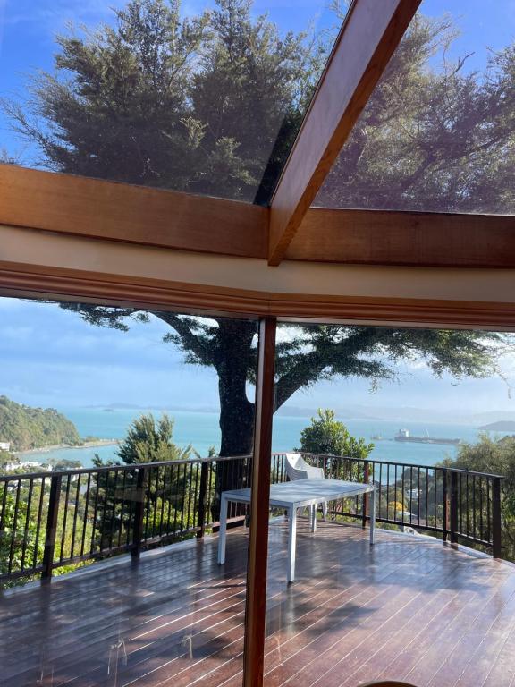 a view of the ocean from the deck of a house at Sea views from holiday home in Lower Hutt