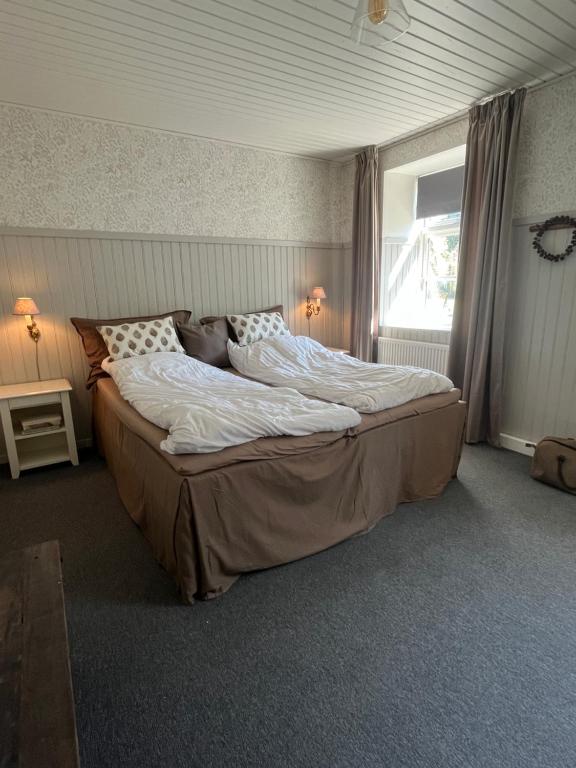 Postel nebo postele na pokoji v ubytování Stenhuset - Country House