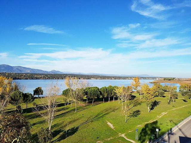 a view of a park with a lake and trees at Villa Paraiso in Cazalegas