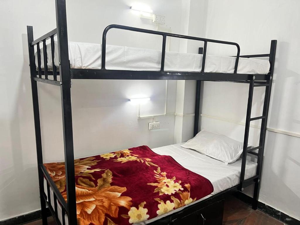 Voodi või voodid majutusasutuse The Bunkyard Hostel toas