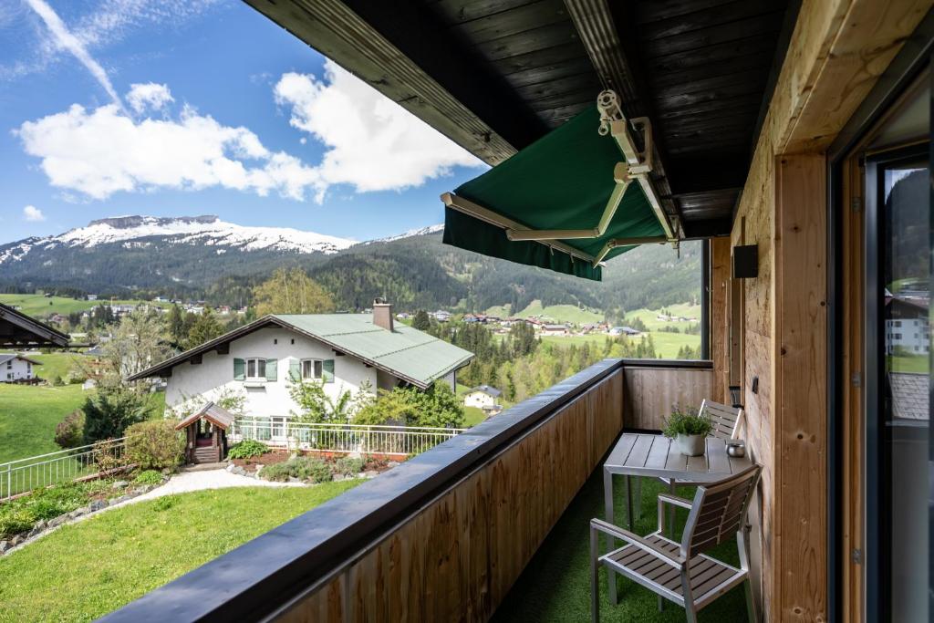 a balcony with a view of a mountain at Haus Tannberg in Riezlern