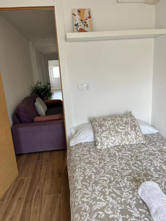 A bed or beds in a room at Apartamento Oasis Mediterráneo