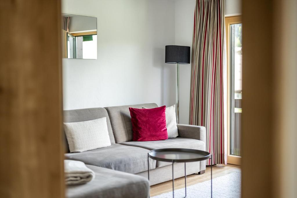 a living room with a couch and a table at Haus Tannberg in Riezlern