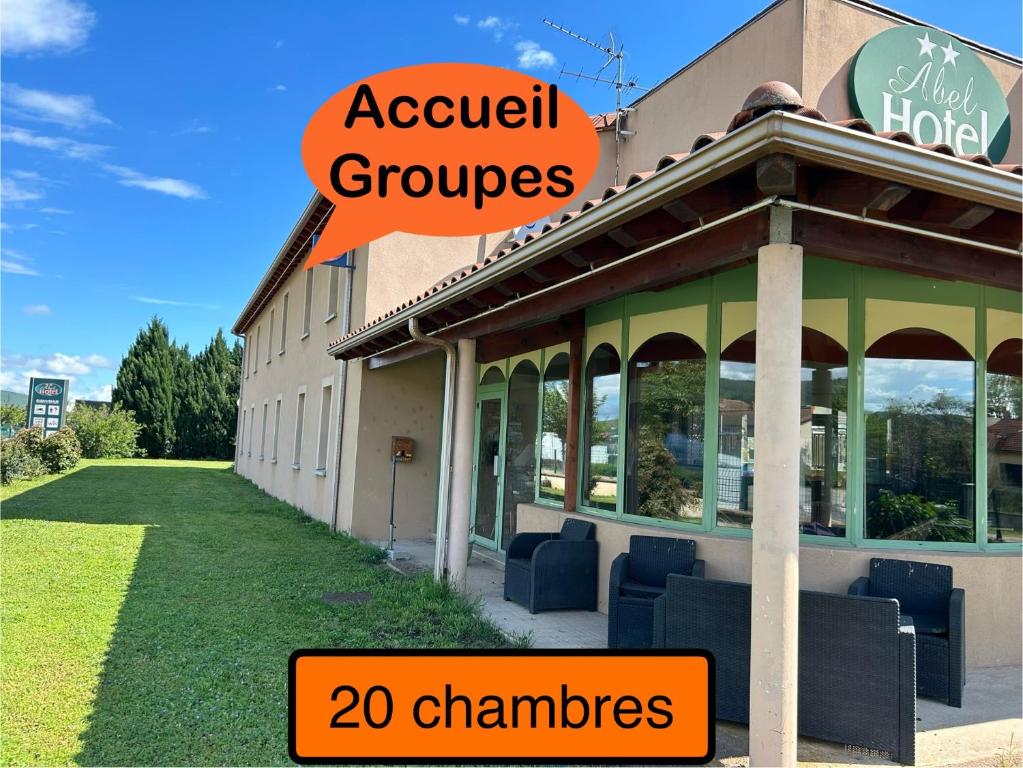 a building with a sign that reads acoustical groups and chambers at Abel Hôtel in Langeac