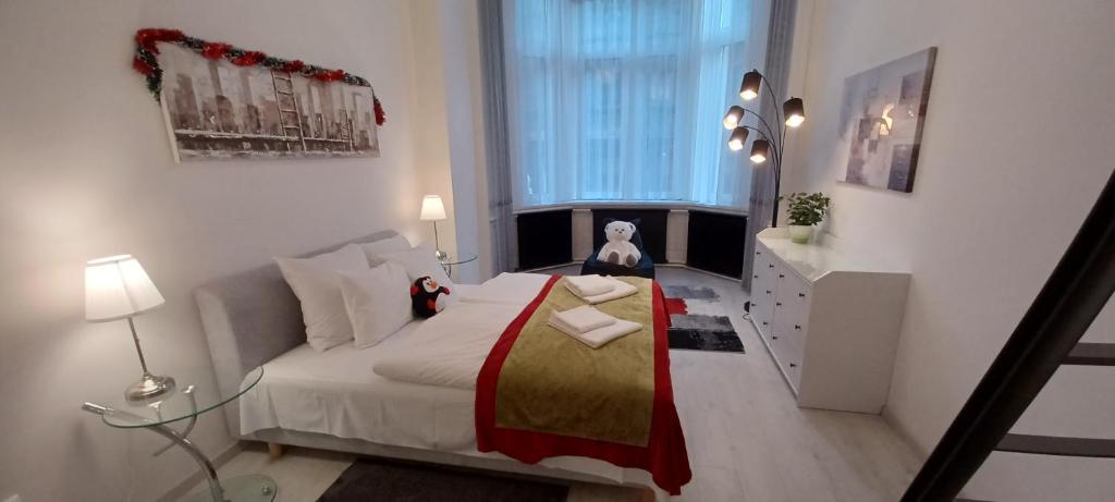 Posteľ alebo postele v izbe v ubytovaní Palace Apartment