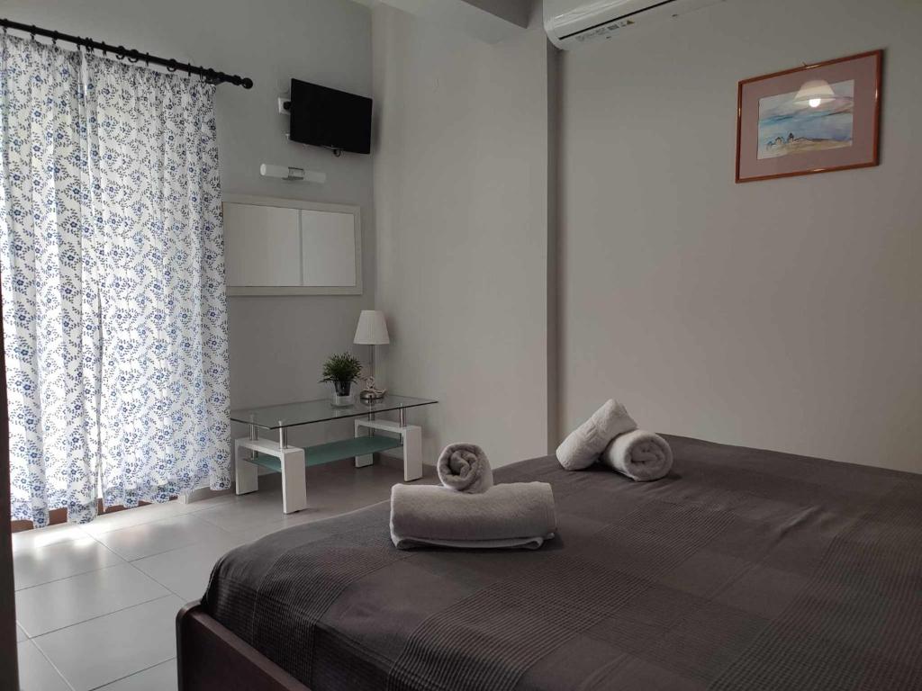 Postel nebo postele na pokoji v ubytování Posidonio Hotel