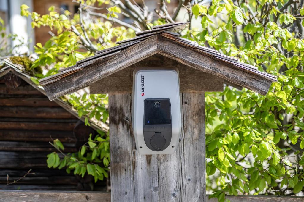 a bird house with a phone in it at Haus Tannberg in Riezlern