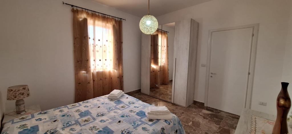 Postel nebo postele na pokoji v ubytování Villetta Lorena a Mancaversa