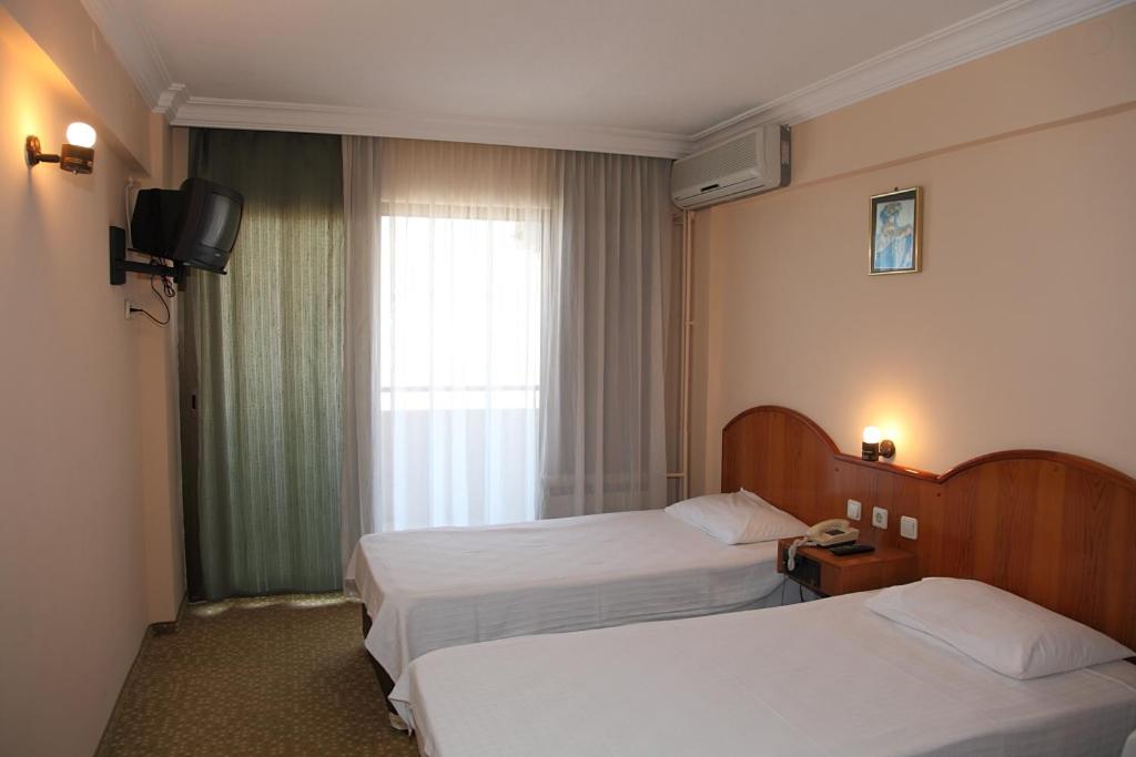 Voodi või voodid majutusasutuse Sergent Hotel toas