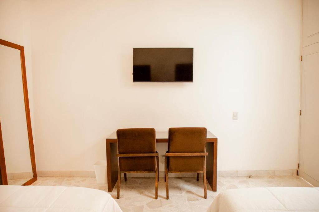 Postel nebo postele na pokoji v ubytování Violeta Hotel Boutique