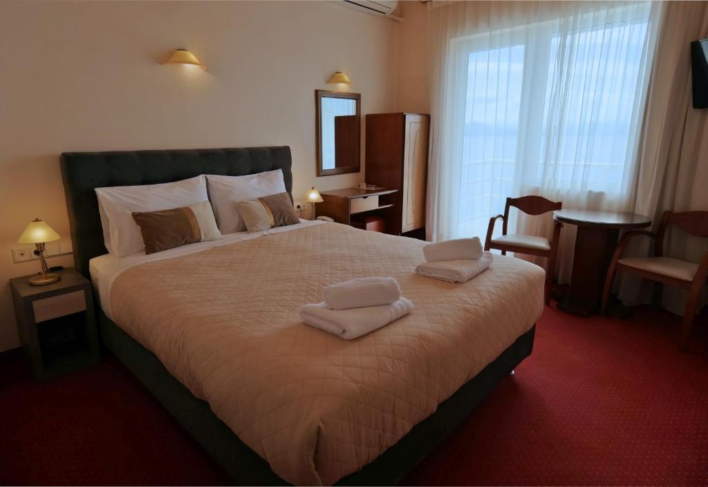 Postel nebo postele na pokoji v ubytování Hotel Excelsior