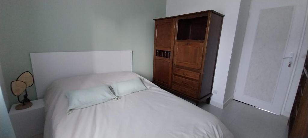 En eller flere senge i et værelse på La maison verte