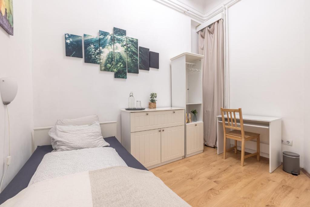 Posteľ alebo postele v izbe v ubytovaní Gellerico Rooms at Horánszky Street