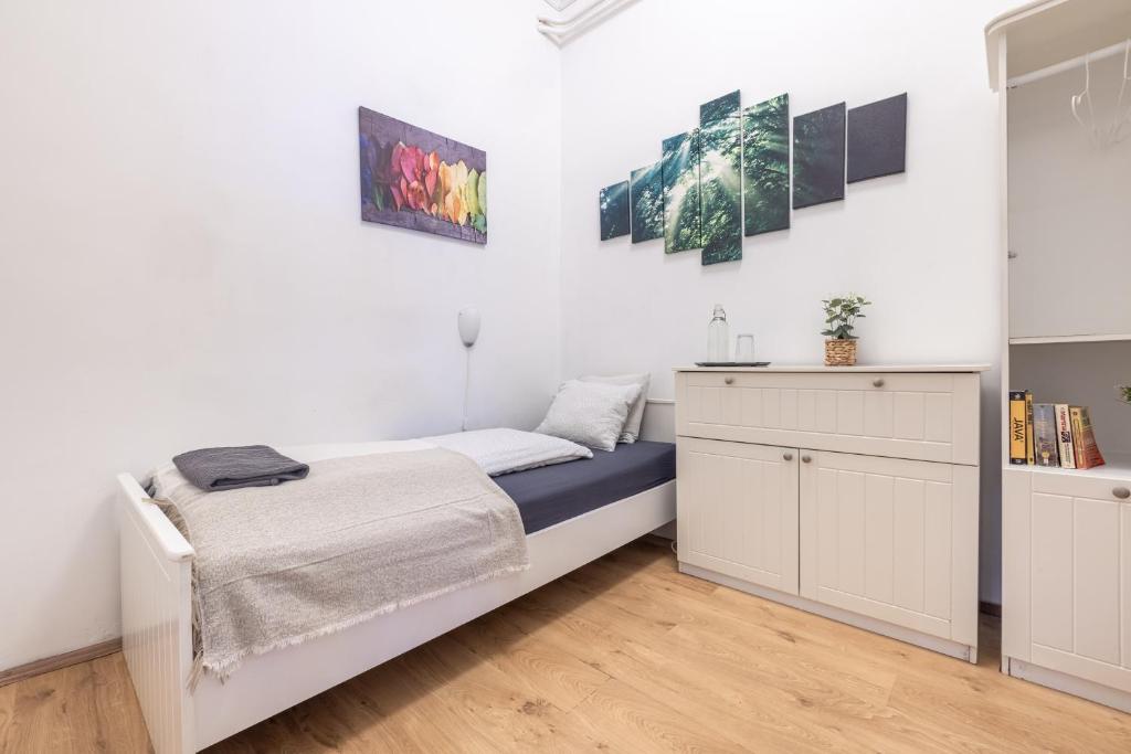 Posteľ alebo postele v izbe v ubytovaní Gellerico Rooms at Horánszky Street