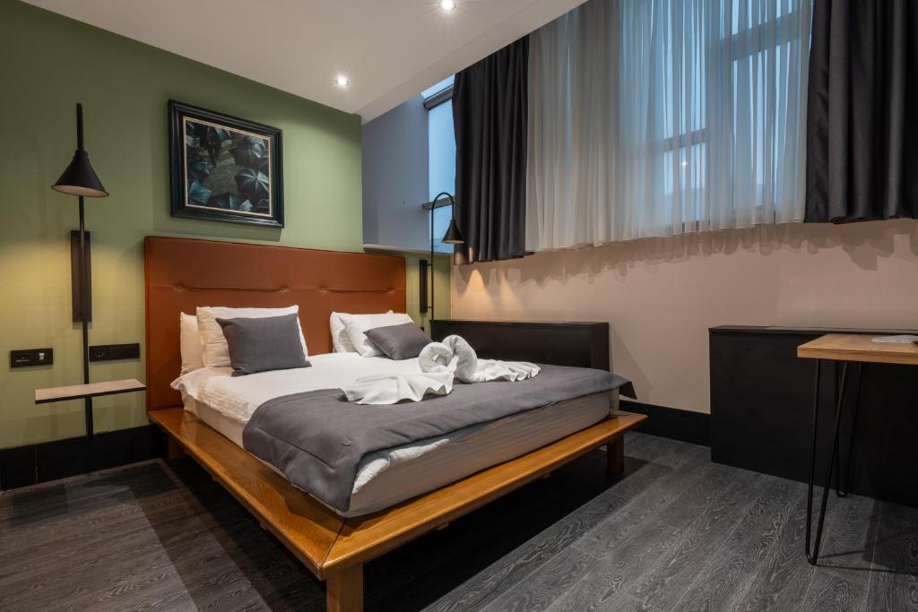 Postel nebo postele na pokoji v ubytování Hotel Astra