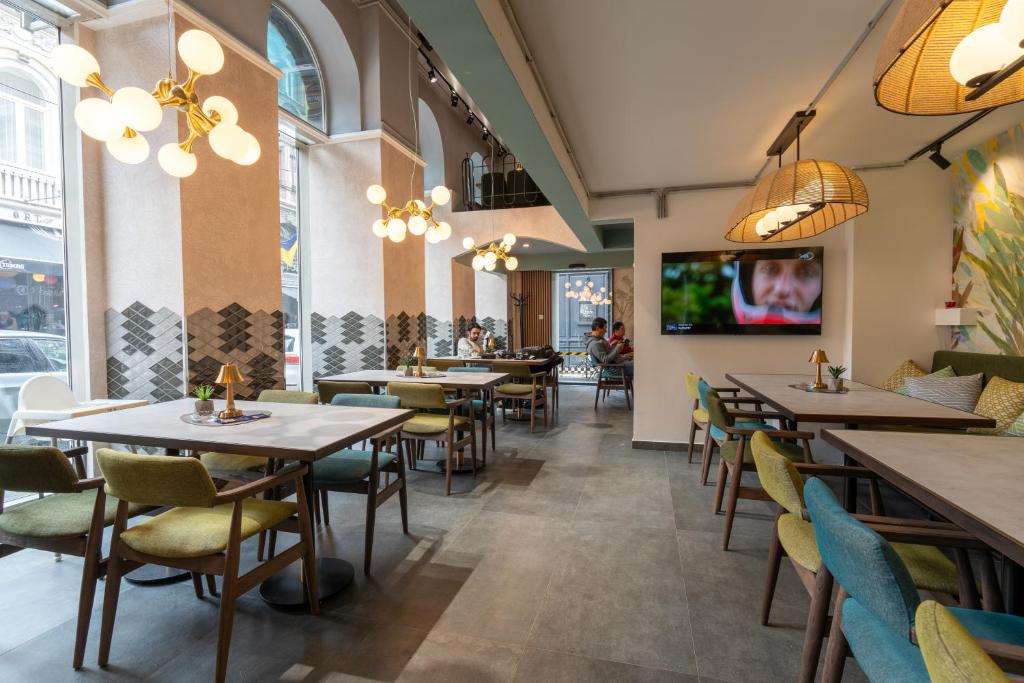 TV a/nebo společenská místnost v ubytování Hotel Astra