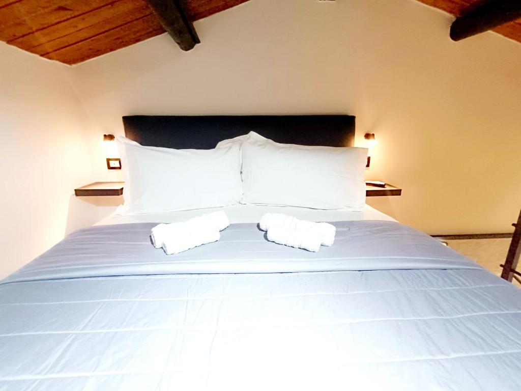 Postel nebo postele na pokoji v ubytování Ti Scialìi Loft