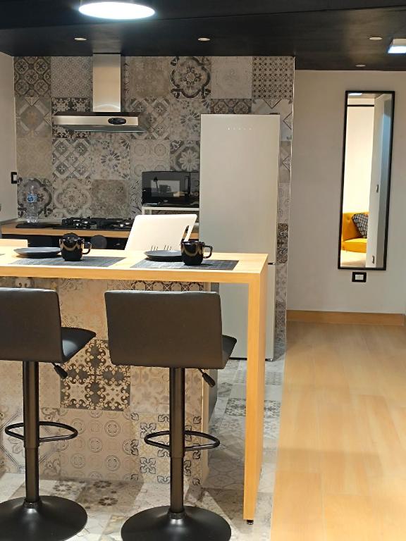 Kuchyň nebo kuchyňský kout v ubytování Ti Scialìi Loft