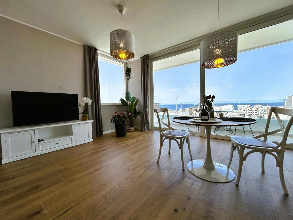A television and/or entertainment centre at Eyes on the sea - Suite deluxe vista mare