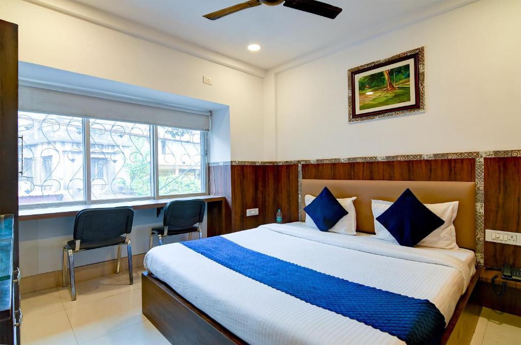 Postel nebo postele na pokoji v ubytování Hotel Q Inn