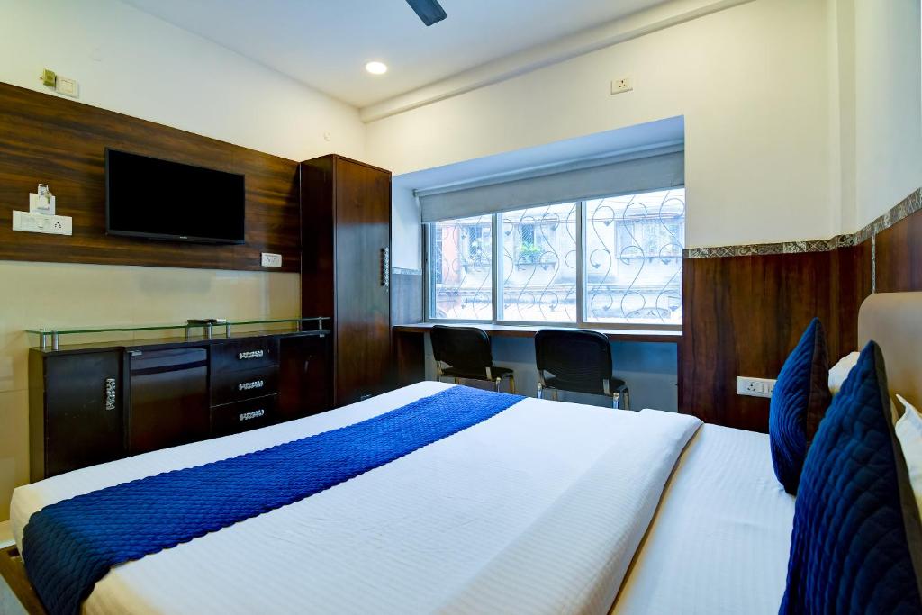 Postel nebo postele na pokoji v ubytování Hotel Q Inn