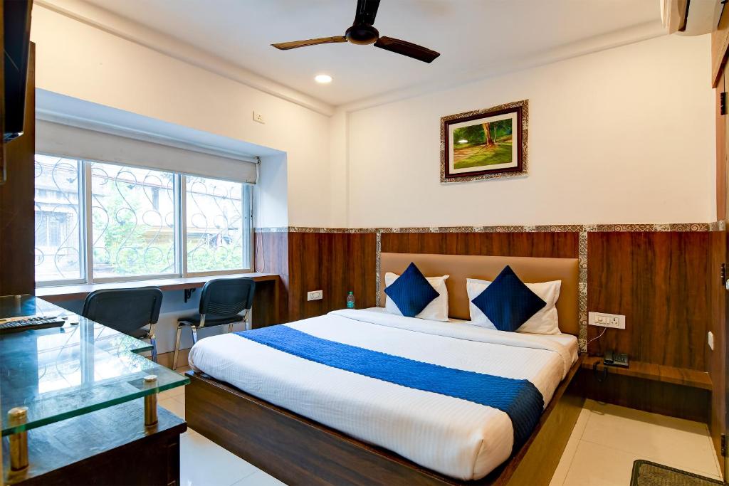 Postel nebo postele na pokoji v ubytování Hotel Q Inn