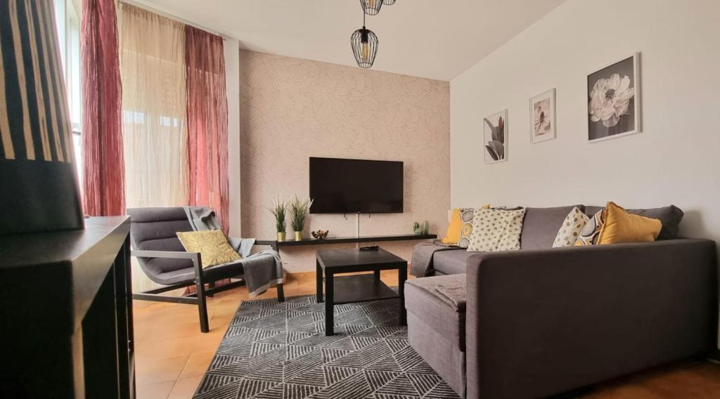 TV a/nebo společenská místnost v ubytování Apartamentos AD