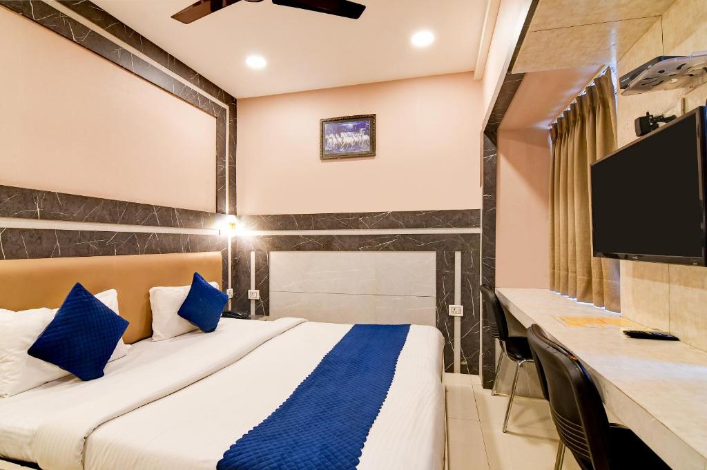 Postel nebo postele na pokoji v ubytování Hotel Q Inn