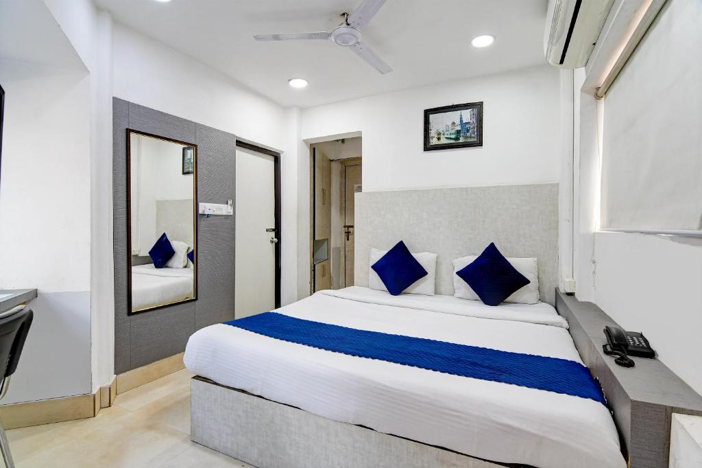 Postel nebo postele na pokoji v ubytování Hotel Q Inn