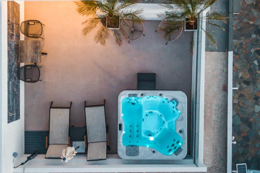 a room with a table and chairs in a room at JnS Premium Stay in Faliraki