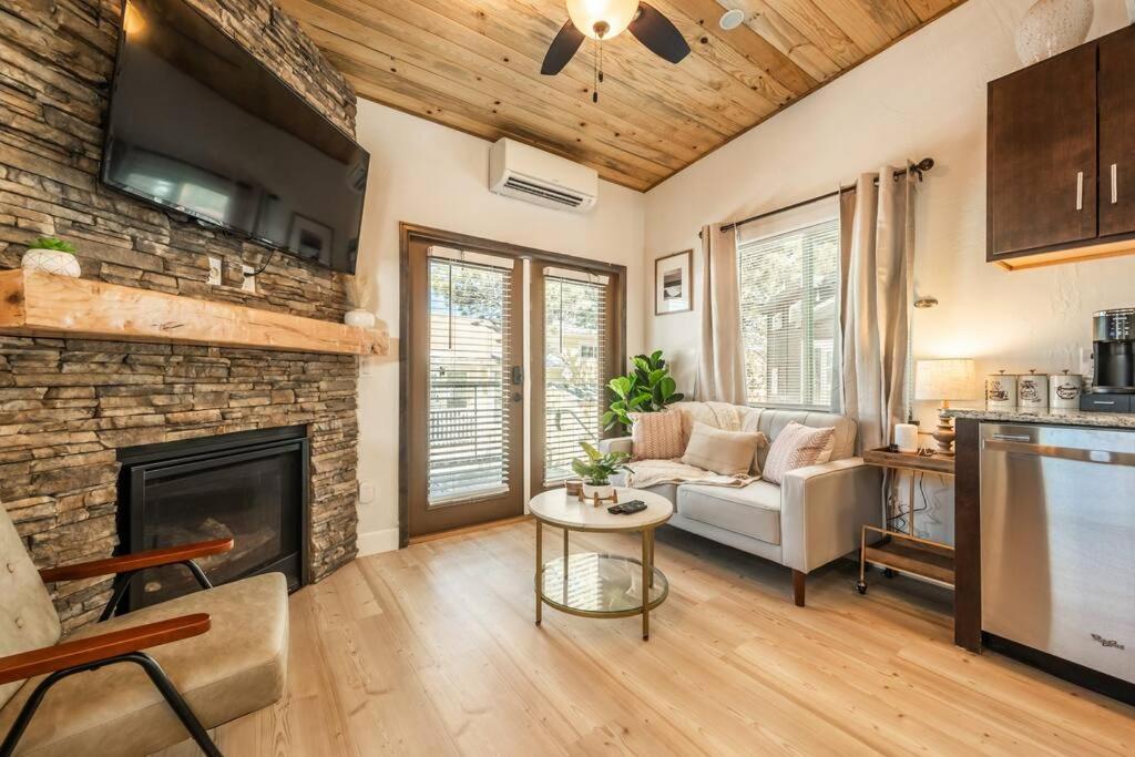 a living room with a couch and a fireplace at Pikes Peak Boutique Retreat! in Woodland Park