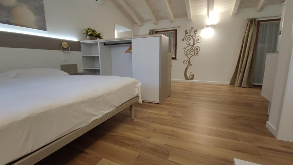 Postel nebo postele na pokoji v ubytování Agriturismo Cjargnei