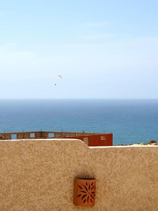 a view of the ocean from the top of a wall at apartment vue Mer in Agadir
