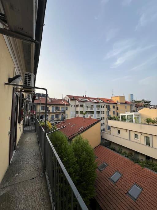 a view of a city from a balcony of a building at Casa di Fausto - CityLife Apartment in Milan